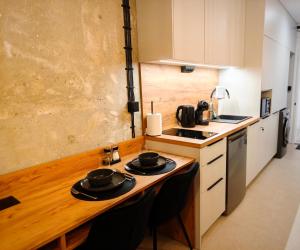 Kuchyň nebo kuchyňský kout v ubytování Axiom Suites - Zenith II - Netflix, HBO, Champagne + 14 fotografií