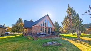 a home with a large deck and a yard at Red Wing Nest home in Redmond