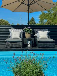 Swimmingpoolen hos eller tæt på Holiday Home With Pool Between Beach And Forest