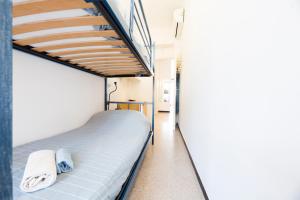 a bedroom with a bunk bed and a staircase at Facing the sea between Cinque Terre and Portofino in Deiva Marina