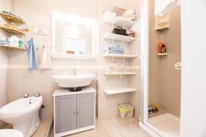 a small bathroom with a sink and a toilet at Facing the sea between Cinque Terre and Portofino in Deiva Marina