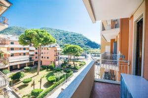 an apartment balcony with a view of a city at Facing the sea between Cinque Terre and Portofino in Deiva Marina