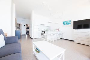 a living room with a couch and a table at Facing the sea between Cinque Terre and Portofino in Deiva Marina +13 photos