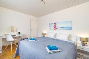 Ένα ή περισσότερα κρεβάτια σε δωμάτιο στο Aparthotel Mama Home Wildegg