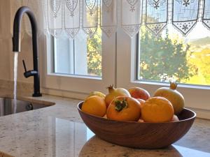 a bowl of fruit on a counter in a kitchen at Villa Rosa in Melgaço
