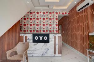 a lobby with a sign on a wall at Super Hotel O ISBT Mohali Formerly Holiday Spot in Mohali