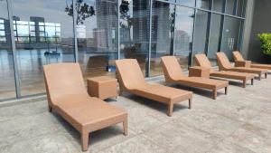 a row of chairs sitting on top of a building at SKS Pavillion Residences in Johor Bahru