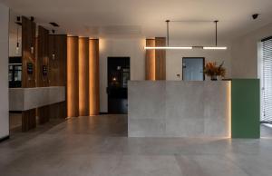 a lobby with a reception desk in a building at WOL Green Polyana in Polyana +62 photos