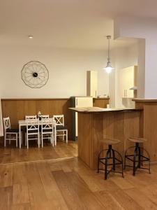 a kitchen and dining room with a table and chairs at Ferienwohnung C und D in Oberthulba
