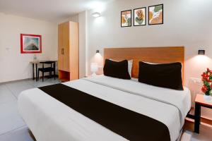 Ένα ή περισσότερα κρεβάτια σε δωμάτιο στο Super Townhouse T Nagar Chennai