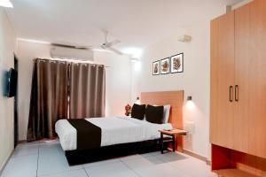 Ένα ή περισσότερα κρεβάτια σε δωμάτιο στο Super Townhouse T Nagar Chennai