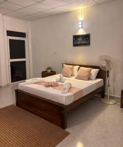 Postel nebo postele na pokoji v ubytování The Kandy Look Homestay