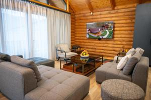 a living room with a couch and chairs and a table at Karpet Dilijan in Dilijan