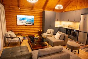 a living room with a couch and a table at Karpet Dilijan in Dilijan