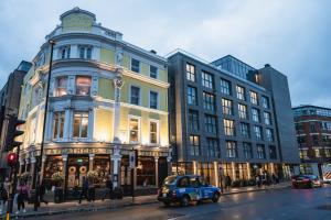 a blue car parked in front of a building at Hotel Indigo London Clerkenwell by IHG in London