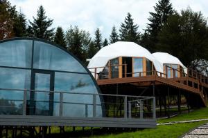 a dome house with a glass facade at Chalet Fomich in Bukovel