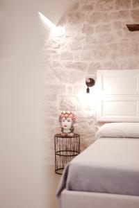 Ένα ή περισσότερα κρεβάτια σε δωμάτιο στο Pepenero Apulian Rooms