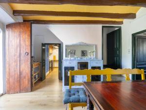 a dining room with a table and a mirror at Mansion in St Martí with Vineyards & Garden in San Martín Sarroca
