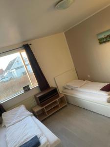 Ένα ή περισσότερα κρεβάτια σε δωμάτιο στο Beautiful single home in Höfn