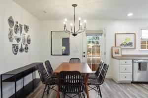 a dining room with a table and chairs at The Clover Cottage in Normaltown in Athens