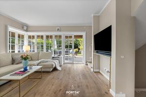 Et tv og/eller underholdning på Ferienhaus Cäcilienhof Ost Kampen auf Sylt