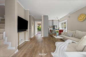 Et tv og/eller underholdning på Ferienhaus Cäcilienhof Ost Kampen auf Sylt