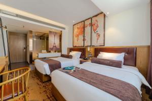 Ένα ή περισσότερα κρεβάτια σε δωμάτιο στο James Joyce Coffetel Beijing Yizhuang Development Zone Yicheng Times Square +33 φωτογραφίες