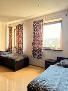 Postel nebo postele na pokoji v ubytování Apartamenty Gliwicka 12