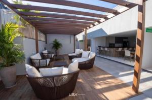 Khu vực ghế ngồi tại Apartamento Home Club, com dois quartos!