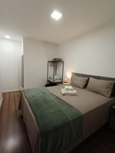 Giường trong phòng chung tại Apartamento Home Club, com dois quartos! +21 ảnh