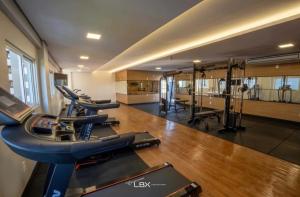 a gym with several treadmills and machines in it at Apartamento Home Club, com dois quartos! in Foz do Iguaçu