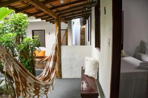 Ένα ή περισσότερα κρεβάτια σε δωμάτιο στο Pousada Eloy Beach