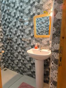 a bathroom with a sink and a shower at Kaouki beachside apartment - 2 people in Essaouira