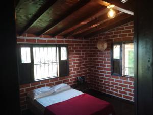 Ένα ή περισσότερα κρεβάτια σε δωμάτιο στο Eco Hostal Arroyave