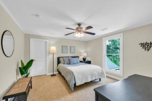 a bedroom with a bed and a ceiling fan at The Wexford French Chateau w Pool in Athens +80 photos