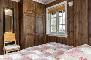 Ένα ή περισσότερα κρεβάτια σε δωμάτιο στο Fjellkos, mountain cabin in Gol