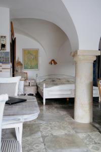 a bedroom with two beds and a table at Agroturystyka "Polna 17" Piętro I Stajnia in Sędziszowa