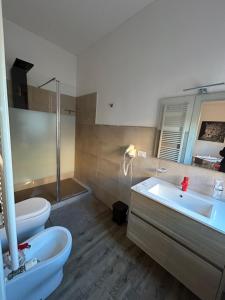 a bathroom with a sink and a toilet and a tub at Stayinbologna 3 in Bologna +83 photos
