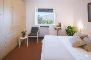 Ένα ή περισσότερα κρεβάτια σε δωμάτιο στο Villa Ponzio