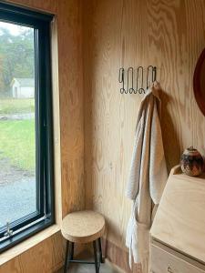 a room with a chair and a window at Architect-Designed House Near Sea On Resö in Resö