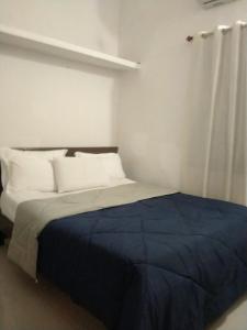 Ένα ή περισσότερα κρεβάτια σε δωμάτιο στο Gennys farmhouse