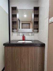 a bathroom with a sink and a mirror at Central Park 2 Bedrooms in Johor Bahru