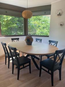 a dining room table with chairs and a basket on top at Villa Pastora in Garganta de los Montes +54 photos