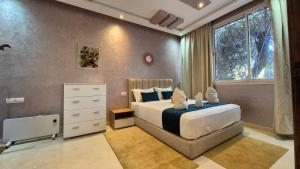 Postel nebo postele na pokoji v ubytování Eco Farm Tayssir Marrakech