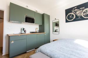 Kuchyň nebo kuchyňský kout v ubytování Cocon Moderne Compans Caffarelli - Métro, Charme & Confort