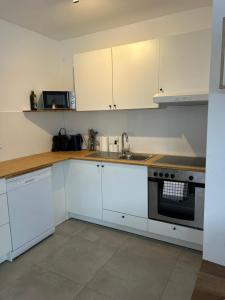 Kuchyň nebo kuchyňský kout v ubytování Chice Moderne Neubauwohnung