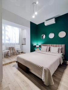 Postel nebo postele na pokoji v ubytování Лайт студия Вокзал Харьков-Пассажирский