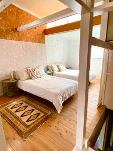 a bedroom with two beds in a room at Takoyaki Time Osaka in Osaka