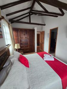 Ένα ή περισσότερα κρεβάτια σε δωμάτιο στο Aparta Hotel El Refugio de María