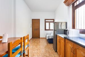 a kitchen with a counter top and a refrigerator at Home2Book Family House with Terrace in Las Maretas in La Mareta